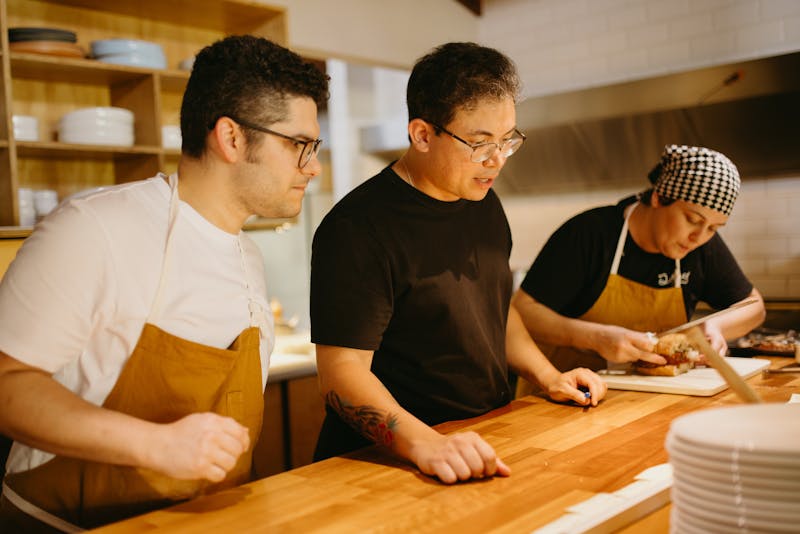 East coast wings team working together in a vibrant kitchen environment